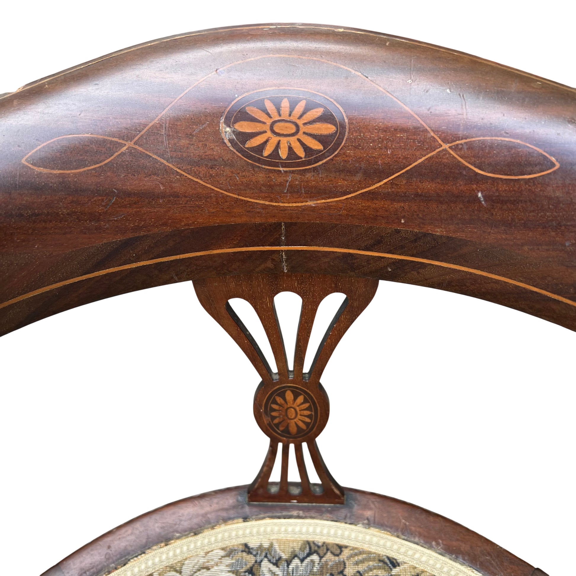 Central pierced splat with floral inlay on Edwardian armchair
