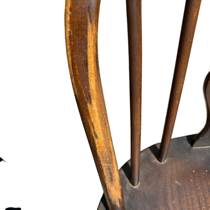 Set of wooden dining chairs displayed at an outdoor antiques sale