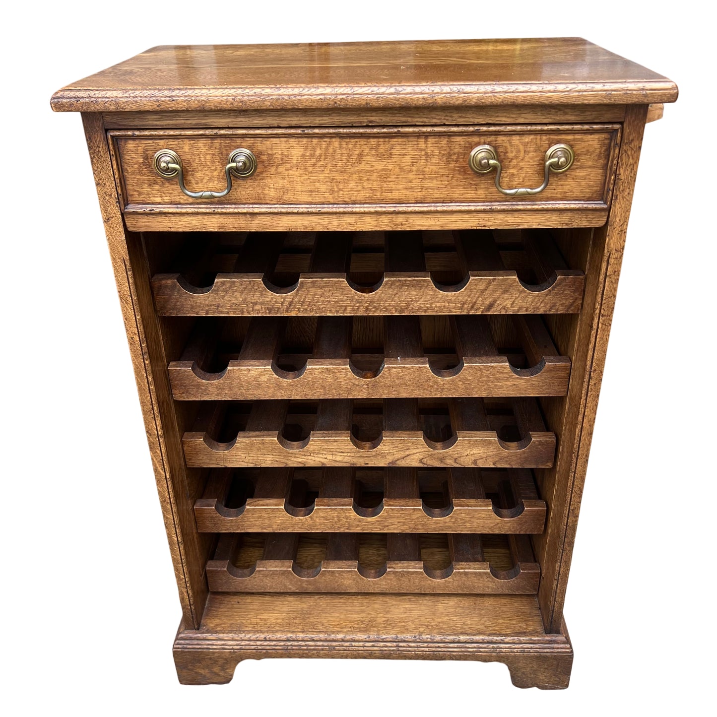 Vintage oak wine cabinet with slotted bottle shelves and brass drop handles