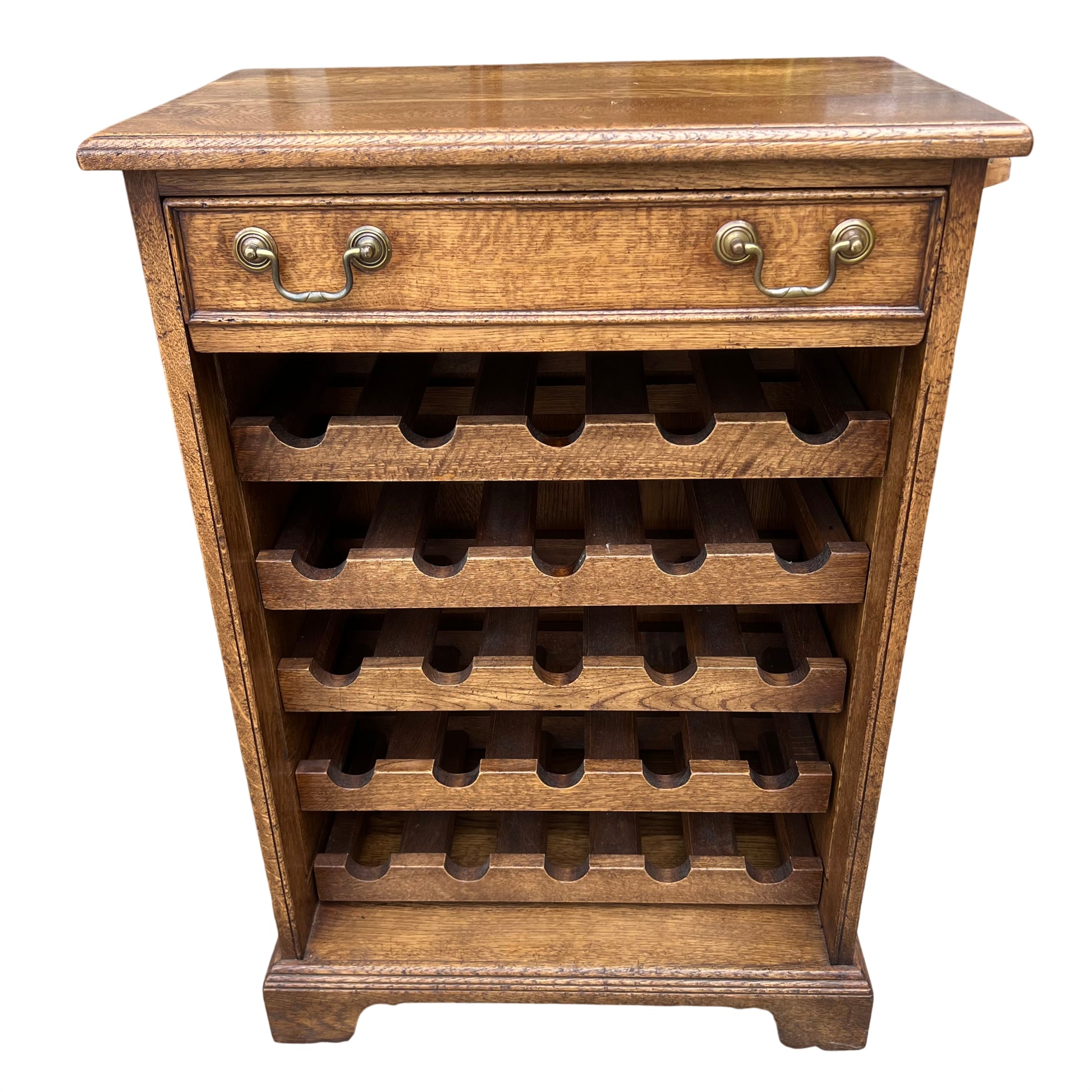 Vintage oak wine cabinet with slotted bottle shelves and brass drop handles