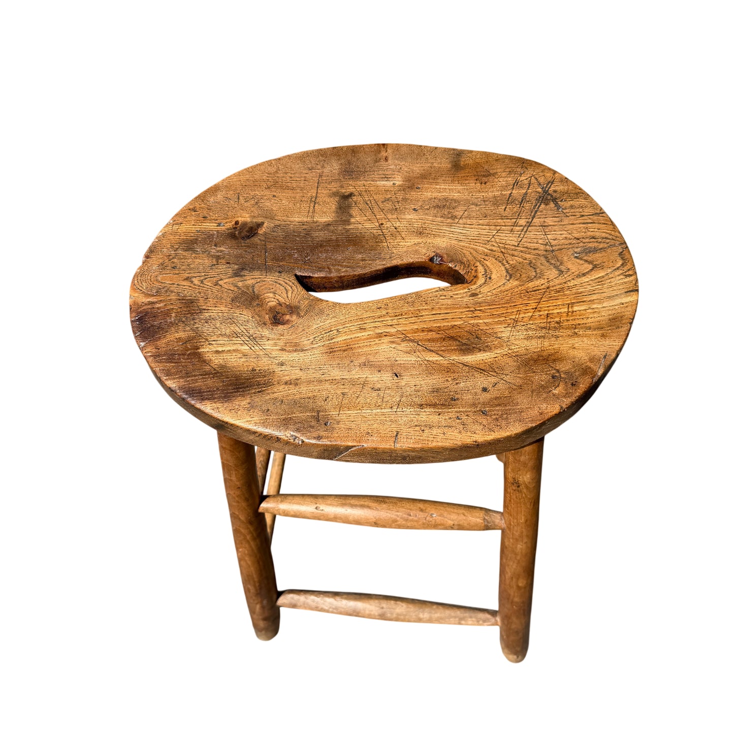 Side view of rustic stool showing turned legs and stretcher bars in oak