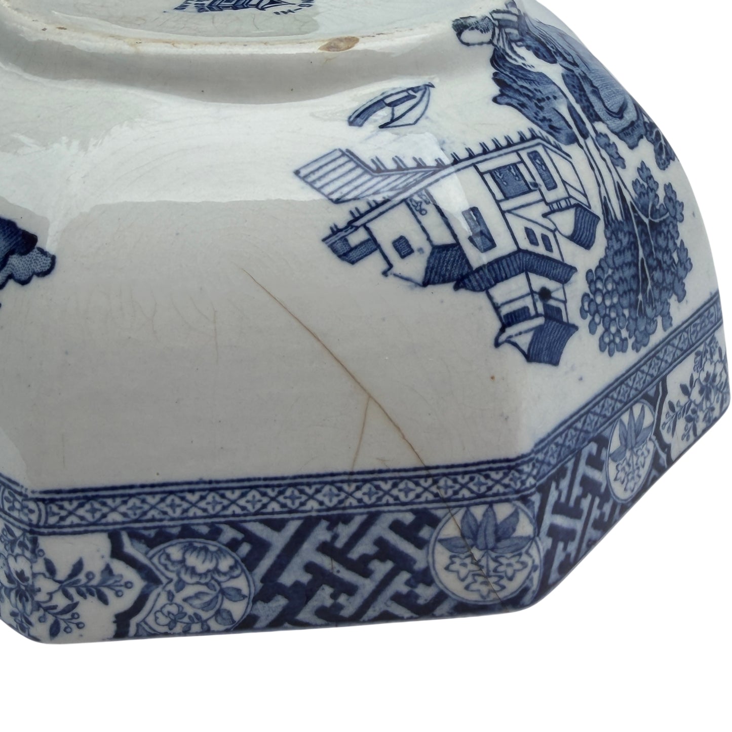 Close-up of footrim area of transferware bowl showing glaze and finish