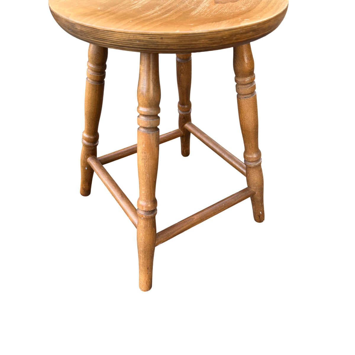 Detail of stool top showing light surface scratches and wood grain