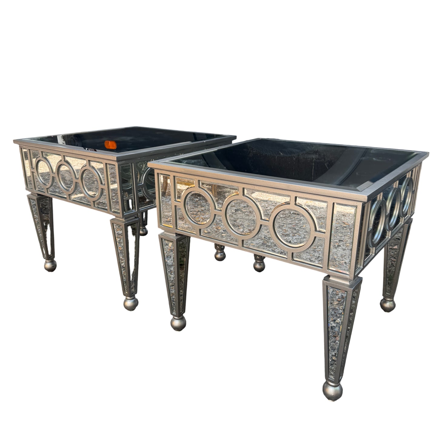 Mirrored side table with bevelled glass top and circular mirrored side panels