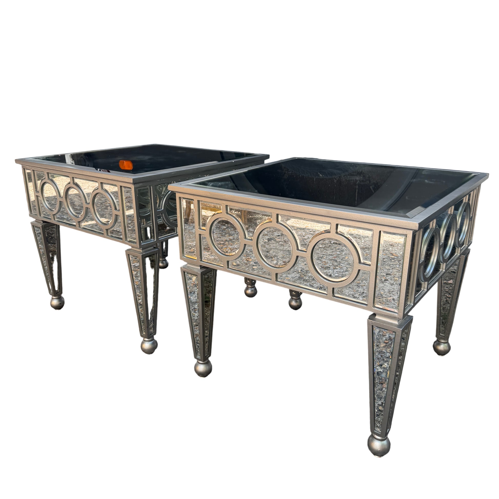 Mirrored side table with bevelled glass top and circular mirrored side panels