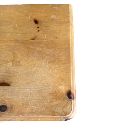 Front view of small pine chest of drawers with four drawers and bun feet
