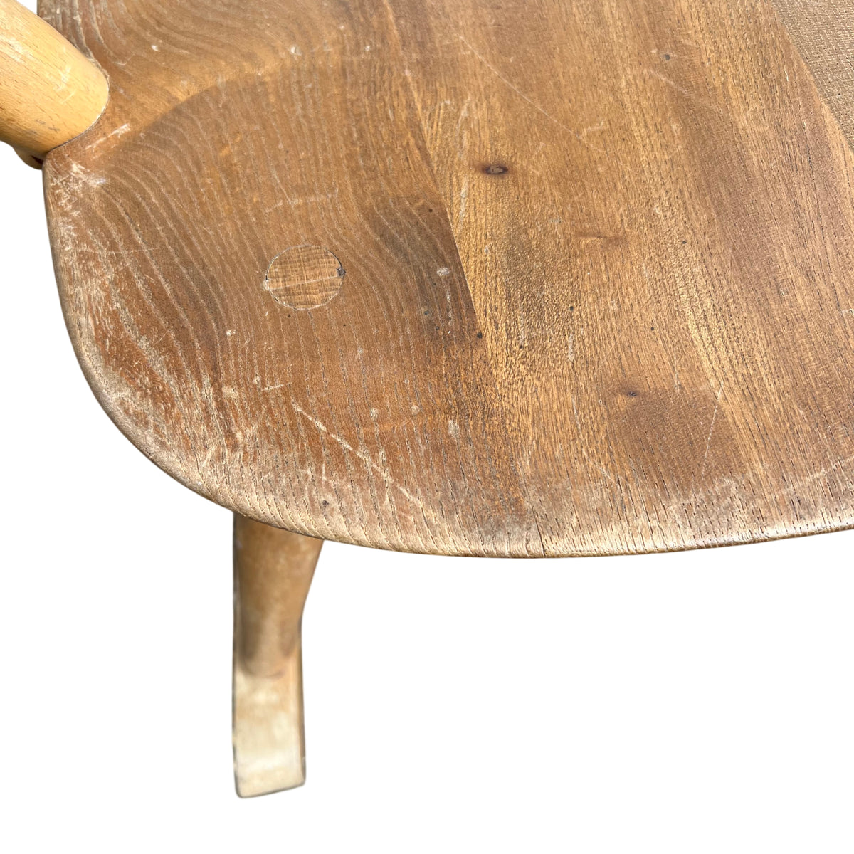 Low-angle view of wooden rocking chair showing seat surface and rockers