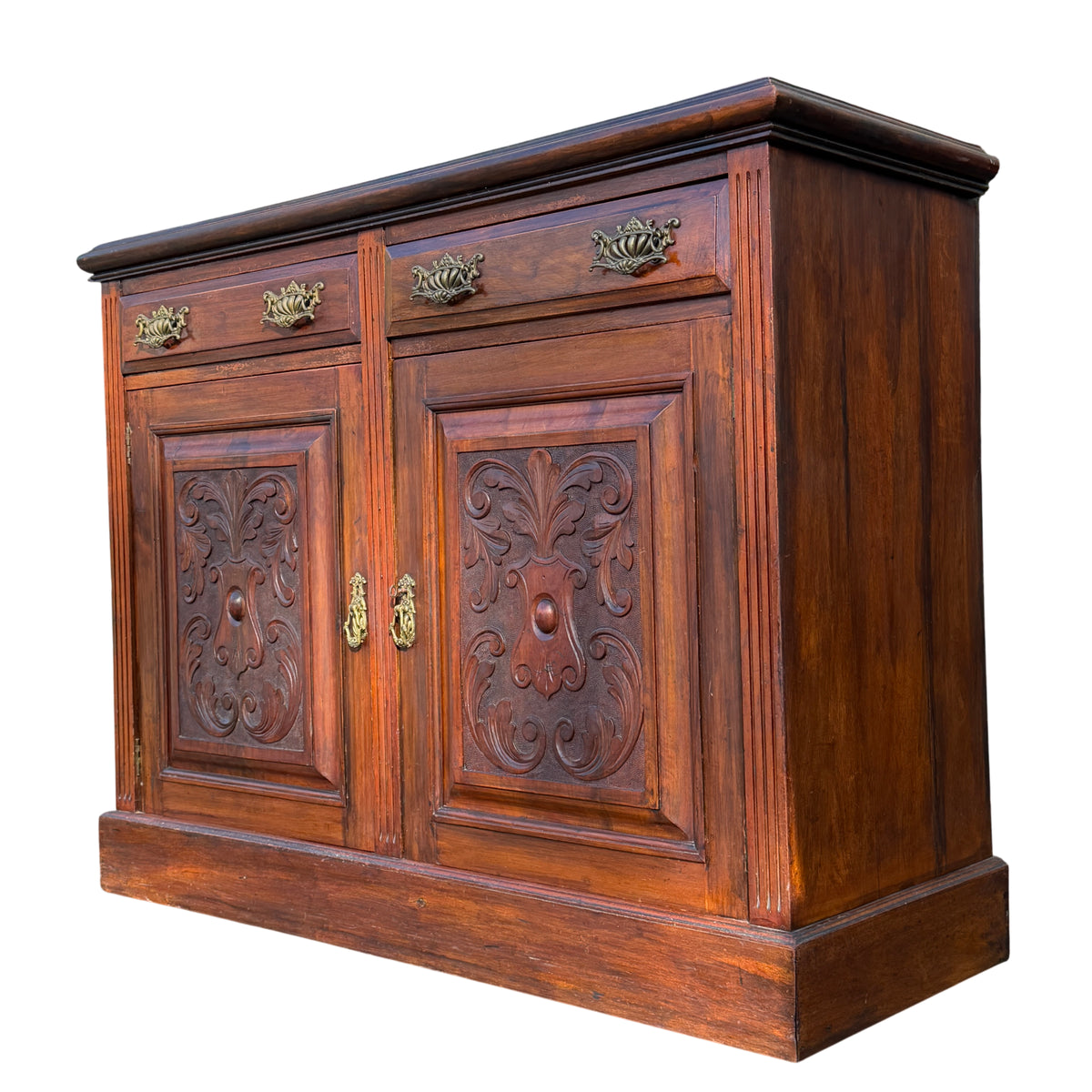 Victorian‑style carved wooden sideboard with two drawers and brass handles