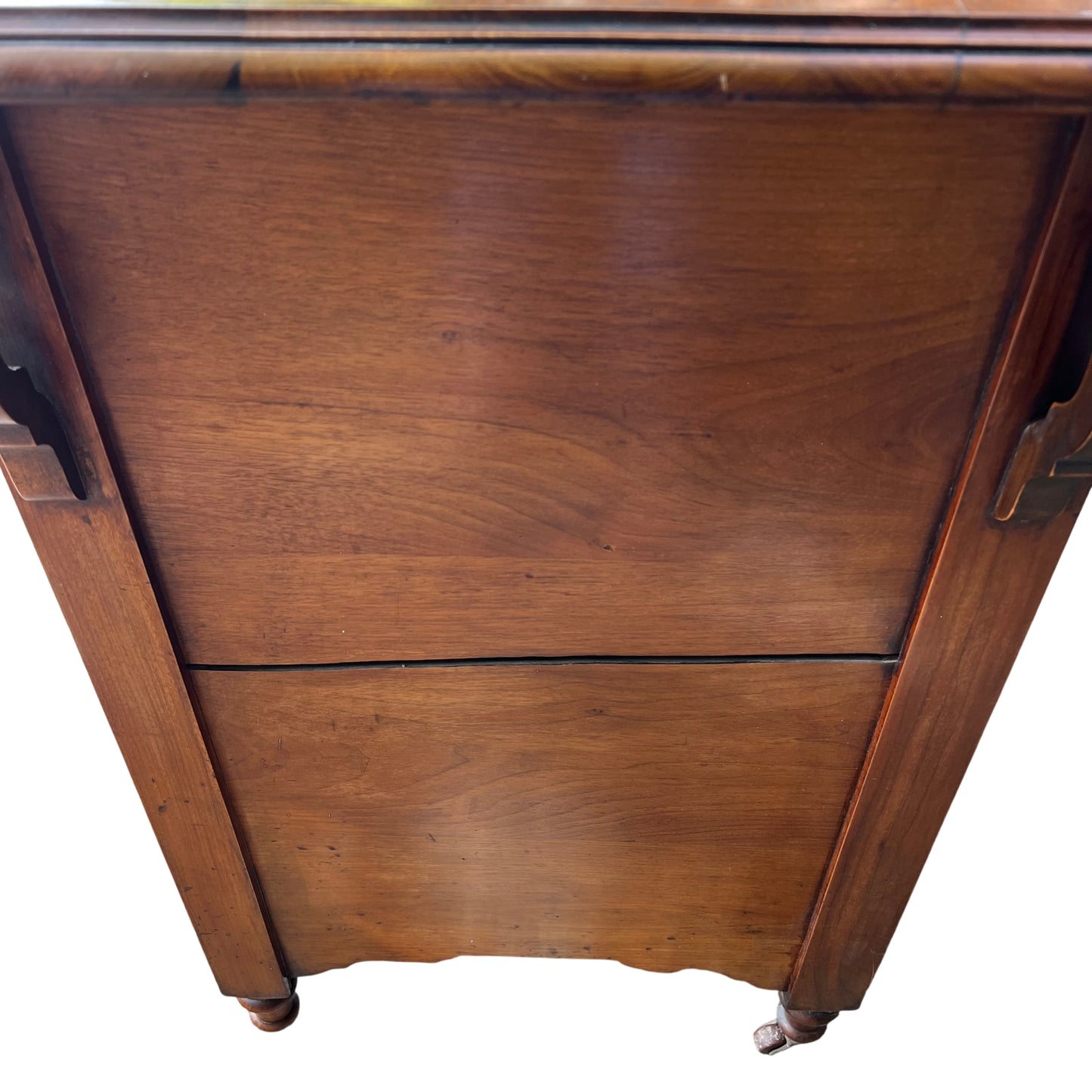 Side view showing decorative oak bracket and case of Victorian chest