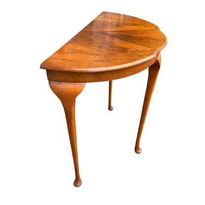 Compact walnut side table with half moon shape and cabriole legs