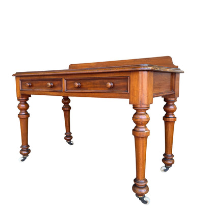 Victorian console table with two drawers and turned legs in mahogany-toned finish
