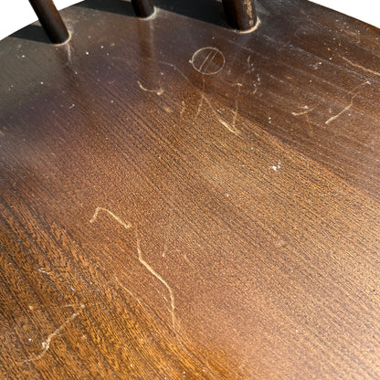 Top-down view of chair seat showing shaped edges and seating surface