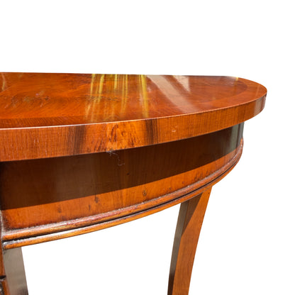 Detail of table apron and central vertical support with decorative escutcheon