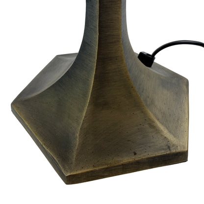 Close-up of cream glass panels and black lead came on a Tiffany-style table lamp