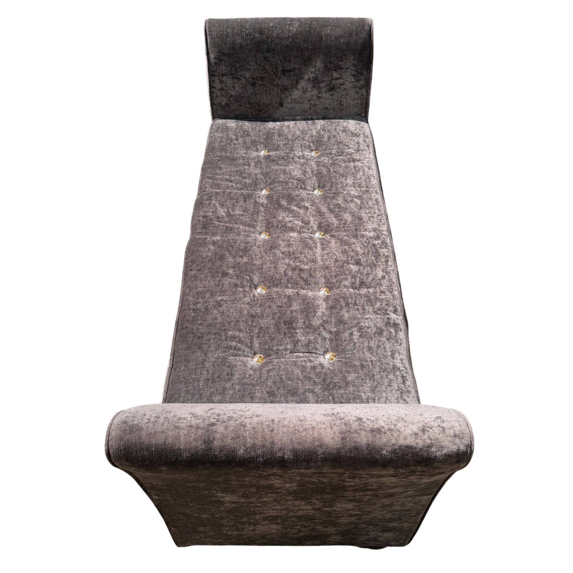 Front view of buttoned velvet daybed with low turned feet and velvet upholstery