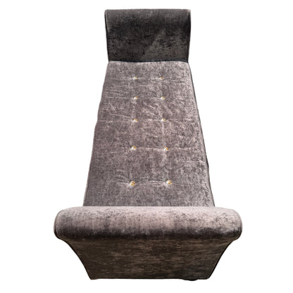 Front view of buttoned velvet daybed with low turned feet and velvet upholstery