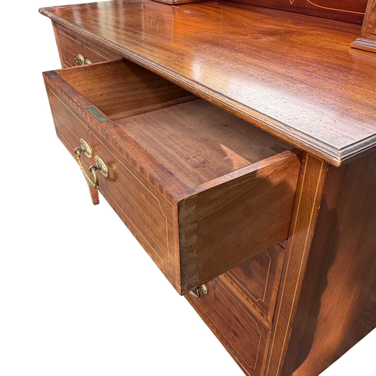 Leg and side view of mahogany chest of drawers on tapered legs