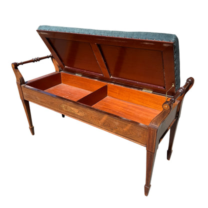 Side view of Edwardian hall bench showing turned arm supports and inlay detail