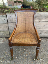 Load image into Gallery viewer, Antique Walnut Cane Work Armchair On Brass Castors
